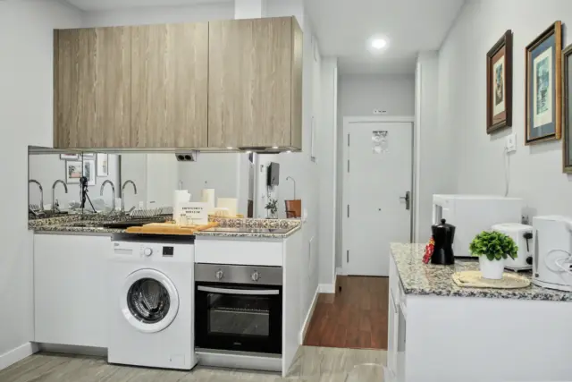 Cocina abierta y comedor del apartamento MINT
